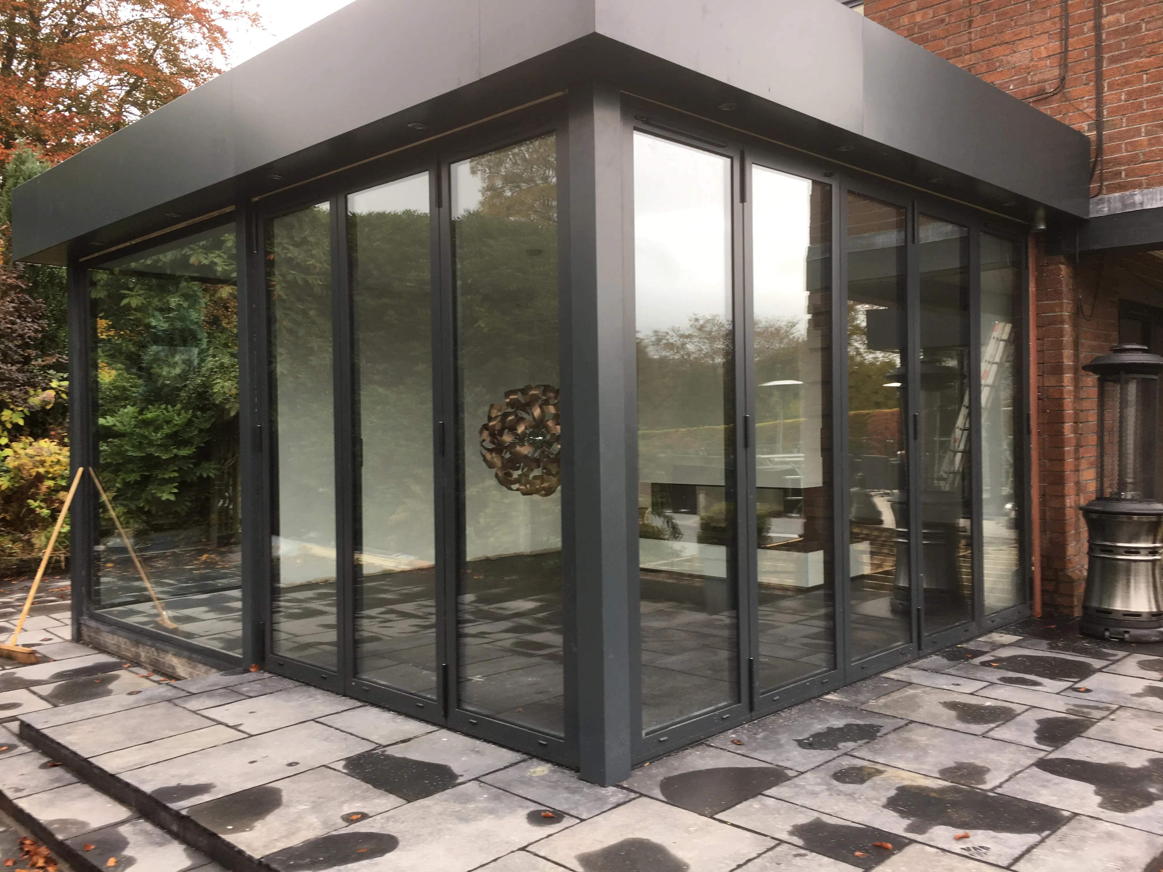 Corner glazed garden room with sliding doors