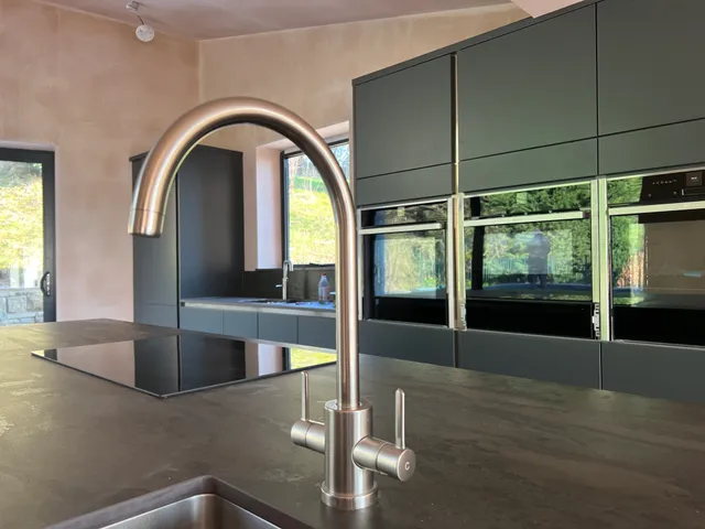 Completed kitchen, tap and worktop detail