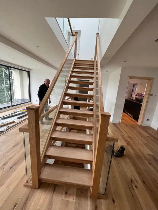 Completed staircase with glass balustrade
