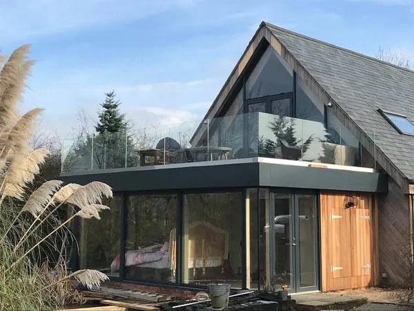 Completed glazed extension with balcony, a separate Landmark project