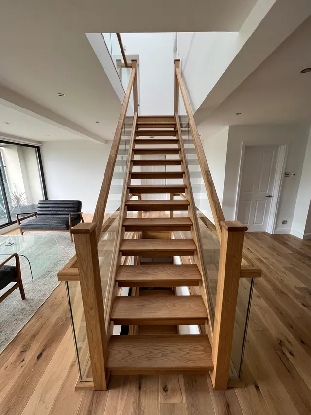 Staircase and living area, upper view