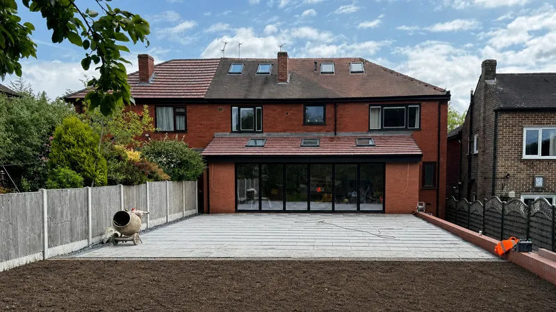 Completed multi-trade extension and patio, viewed from the garden