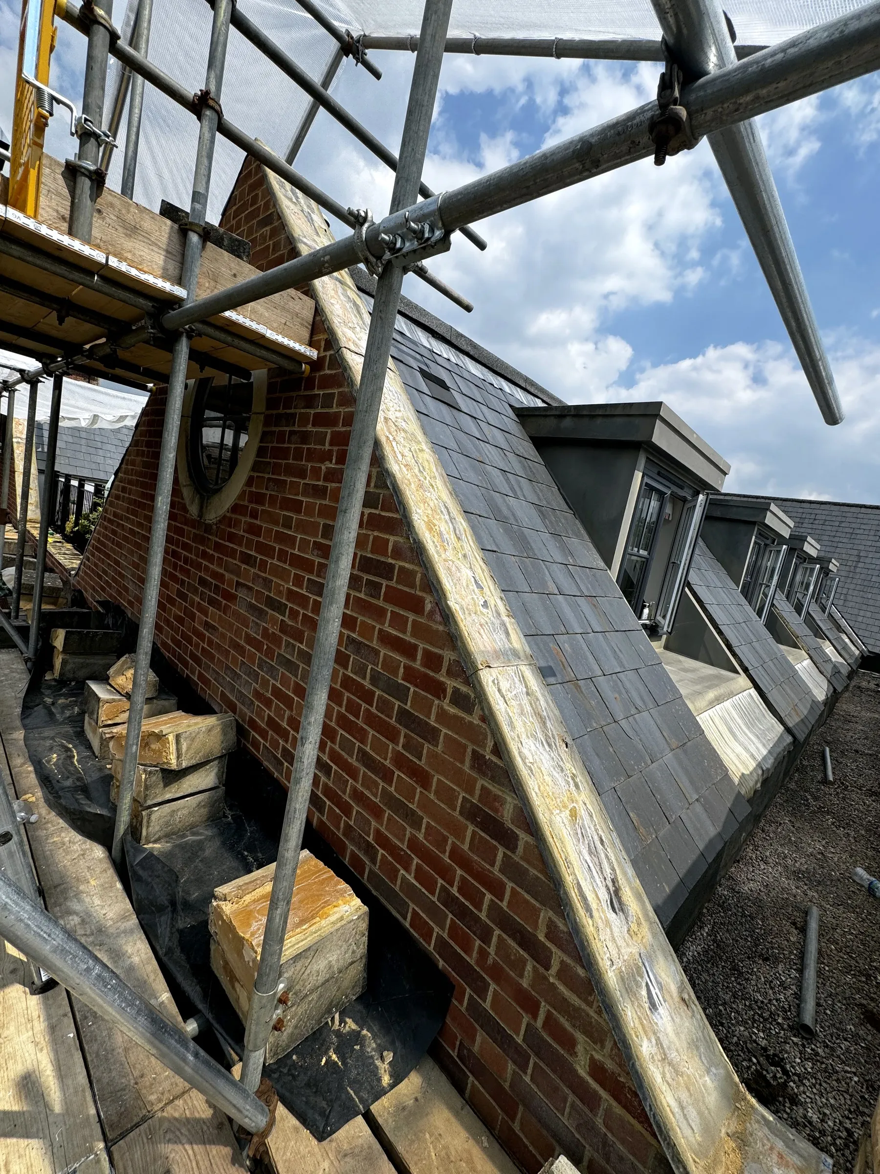 Roofing and external repair work under way from the scaffold